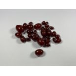 A COLLECTION OF LOOSE CHERRY AMBER BEADS