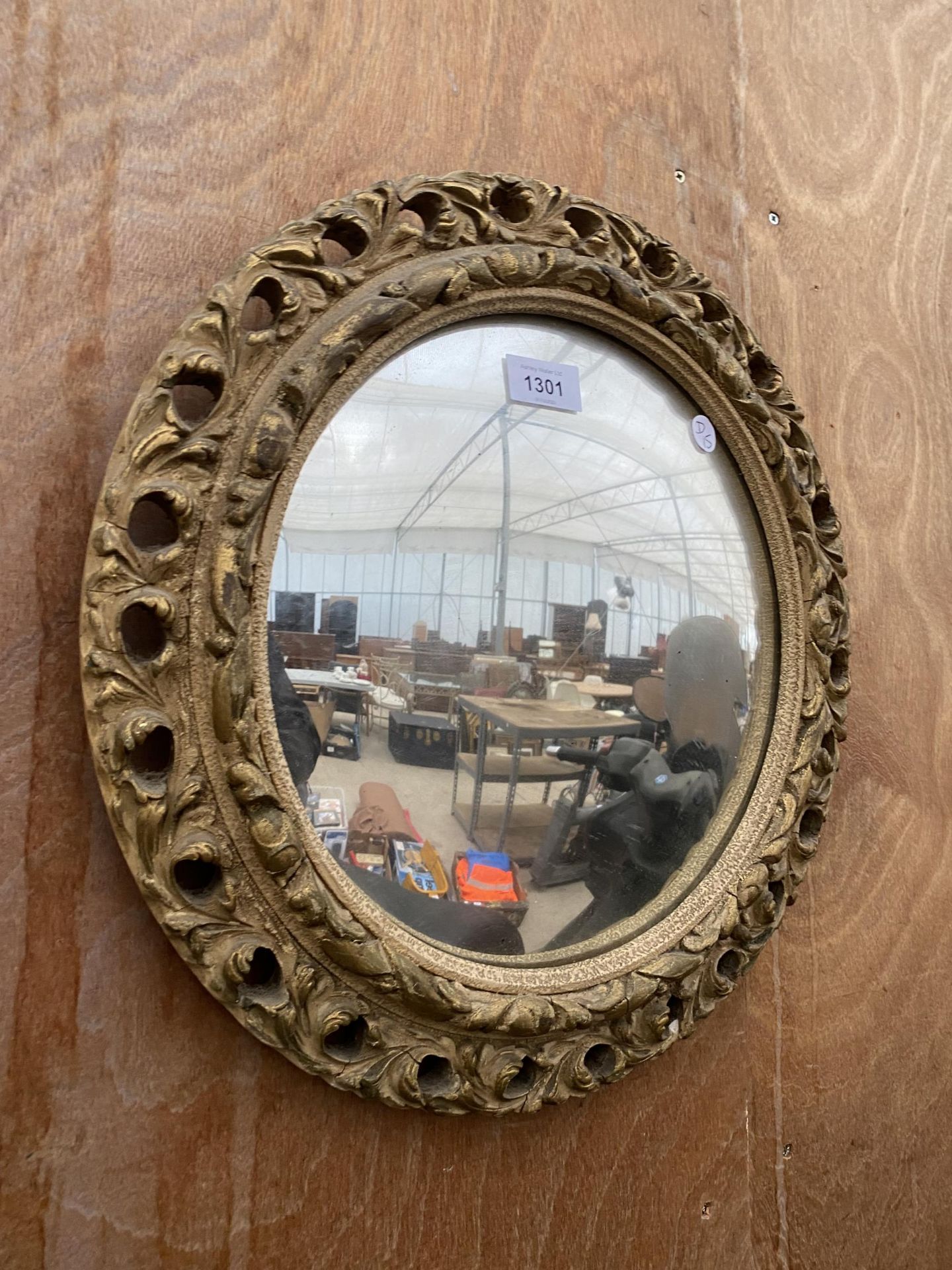 A GILT FRAMED VINTAGE STYLE MIRROR