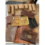 A QUANTITY OF LEATHER PURSES, WALLETS, PASSPORT HOLDERS, ETC.,