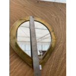 AN ARTS AND CRAFTS STYLE BRASS FRAMED TEARDROP MIRROR