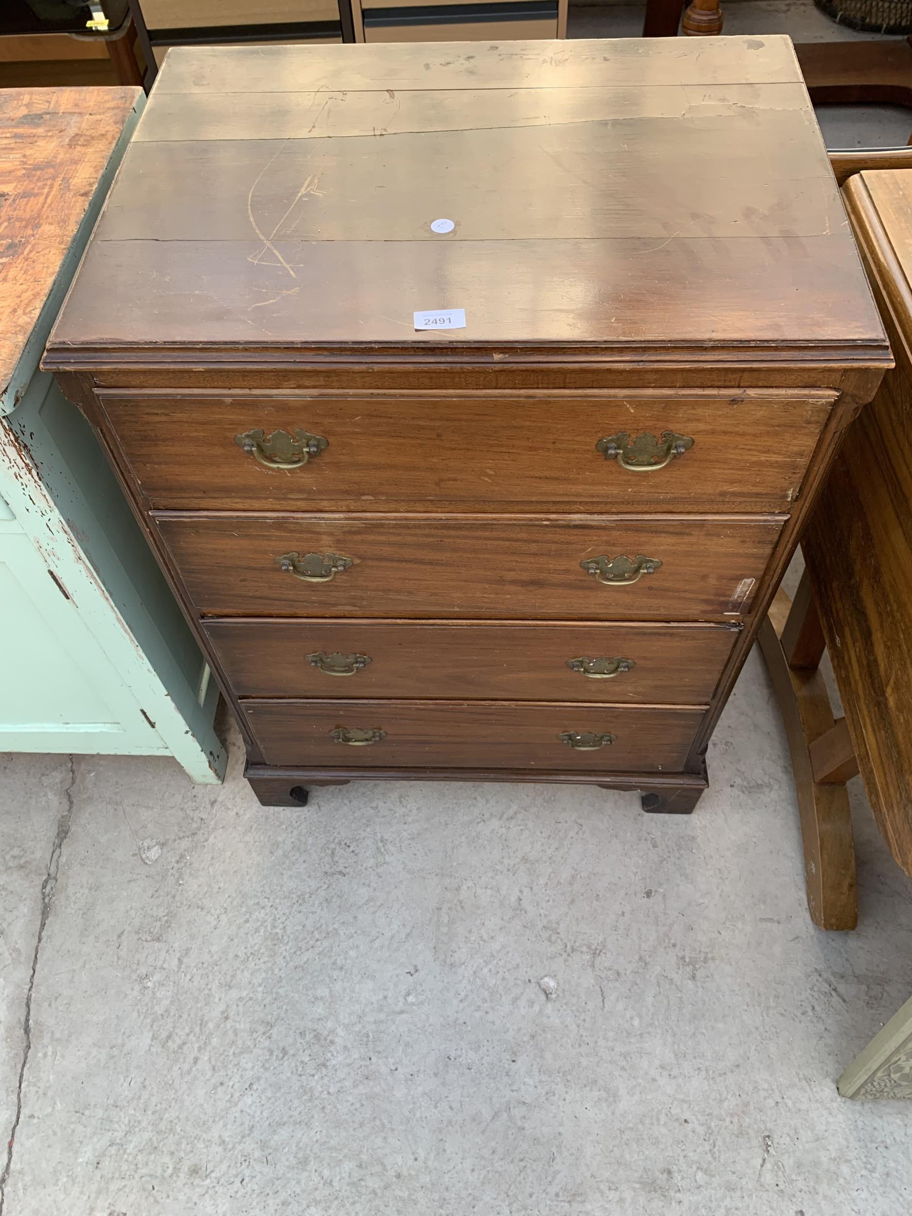 A MID 20TH CENTURY MAHOGANY CHEST OF FOUR DRAWERS, 25" WIDE