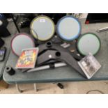 A PLAYSTATION DRUM KIT AND TWO GAMES TO INCLUDE GUITAR HERO WORLD TOUR