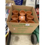 A LARGE QUANTITY OF SMALL TERRACOTTA POTS