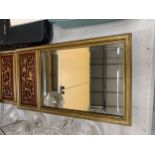A PAIR OF VINTAGE STYLE MIRRORS WITH A CUT AWAY PANEL TO THE TOP 28.5CM X 50CM