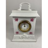 A CONTINENTAL CERAMIC MANTLE CLOCK