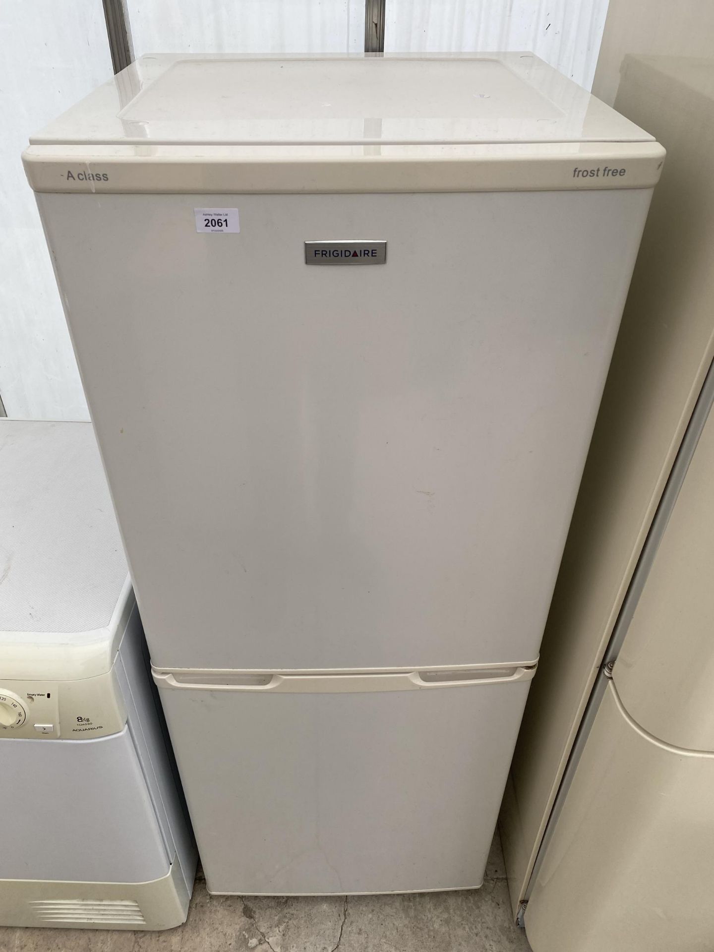 A WHITE FRIGIDAIRE UPRIGHT FRIDGE FREEZER