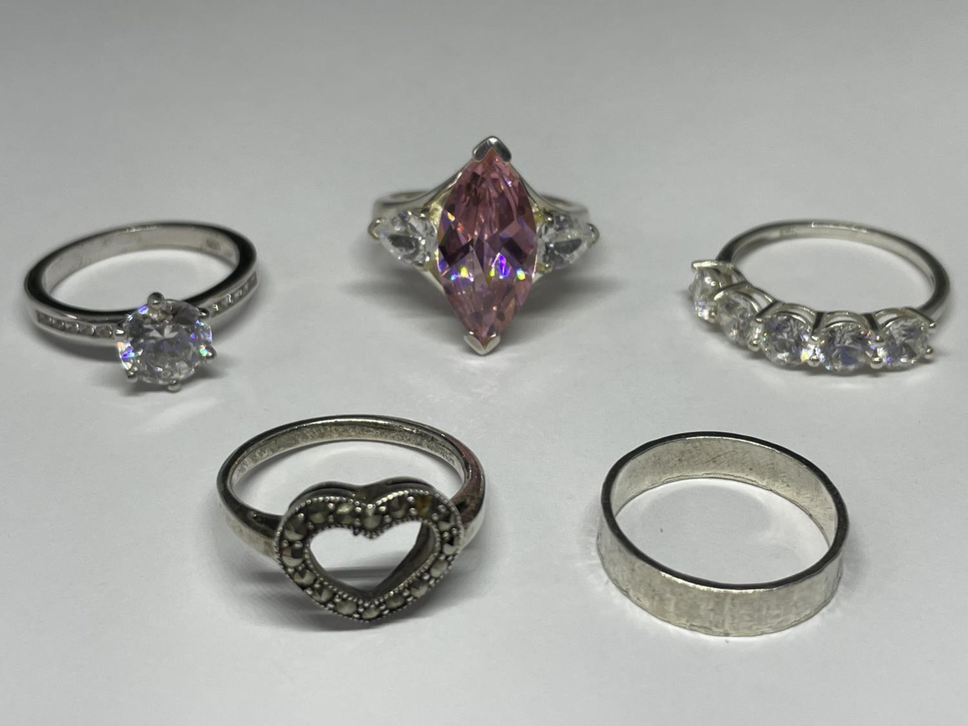 FIVE VARIOUS SILVER RINGS