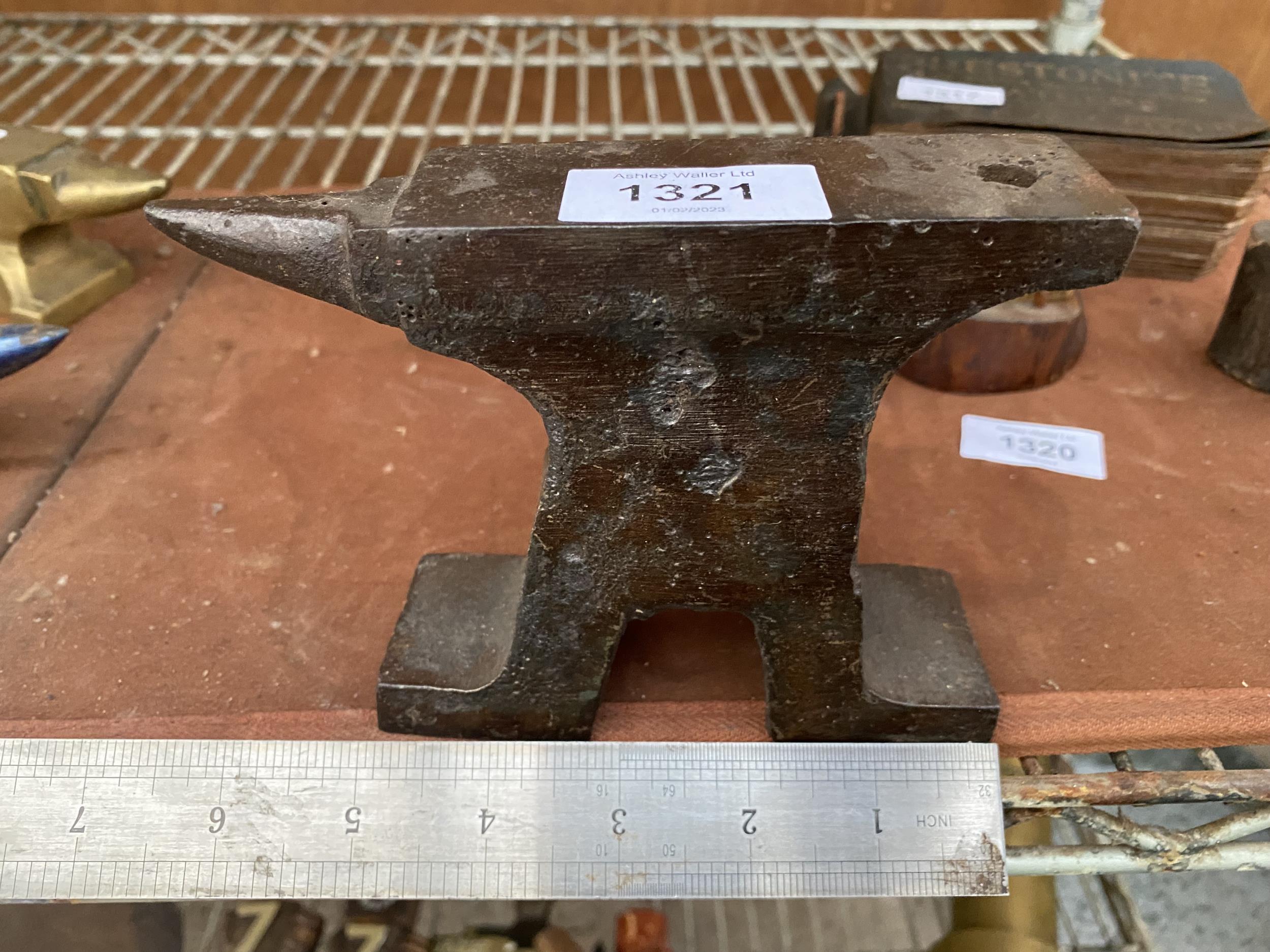 A CAST IRON MINITURE SAMPLE ANVIL