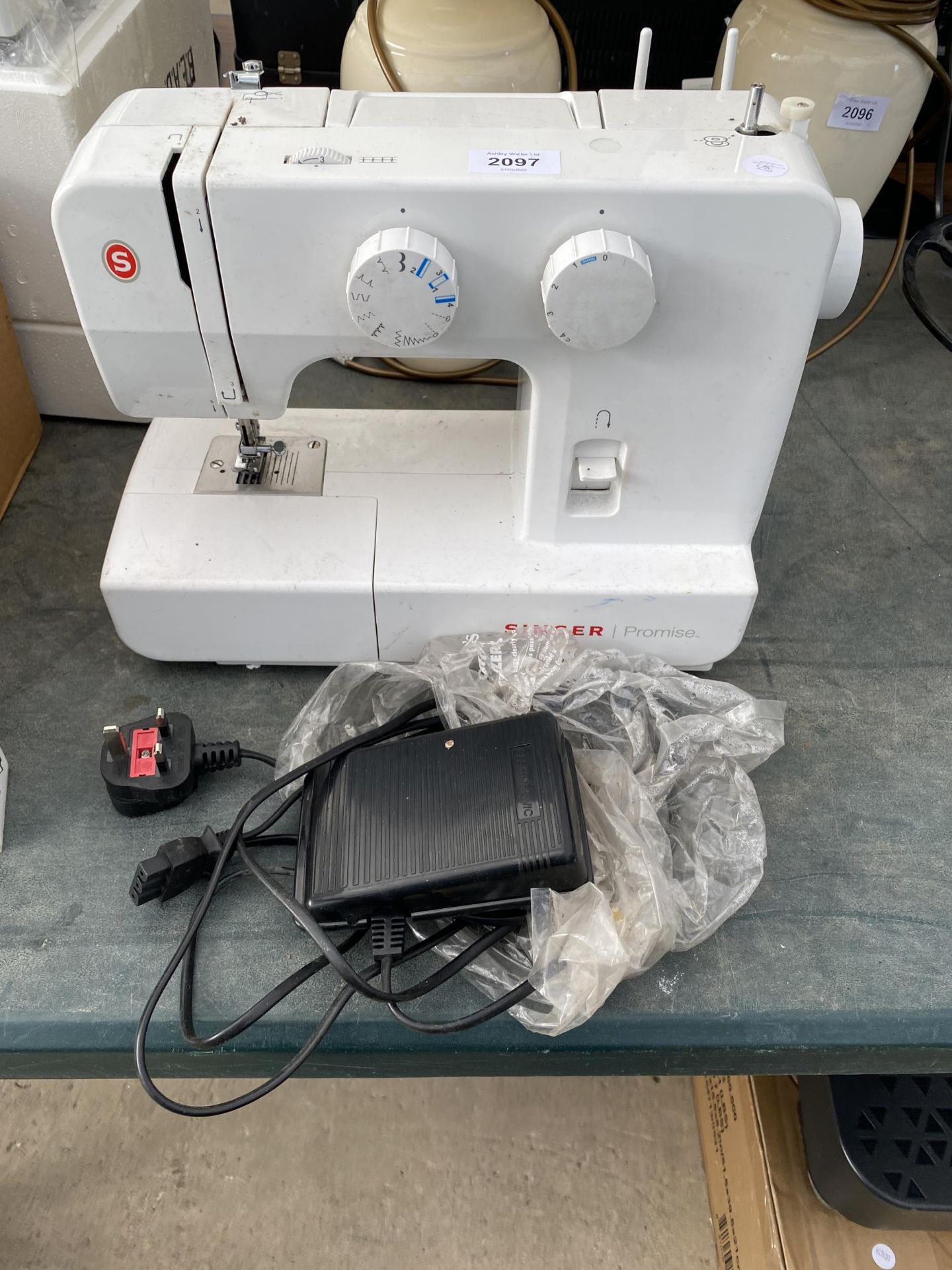 A SINGER PROMISE ELECTRIC SEWING MACHINE