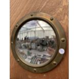 A SMALL BRSS FRAMED PORTHOLE MIRROR