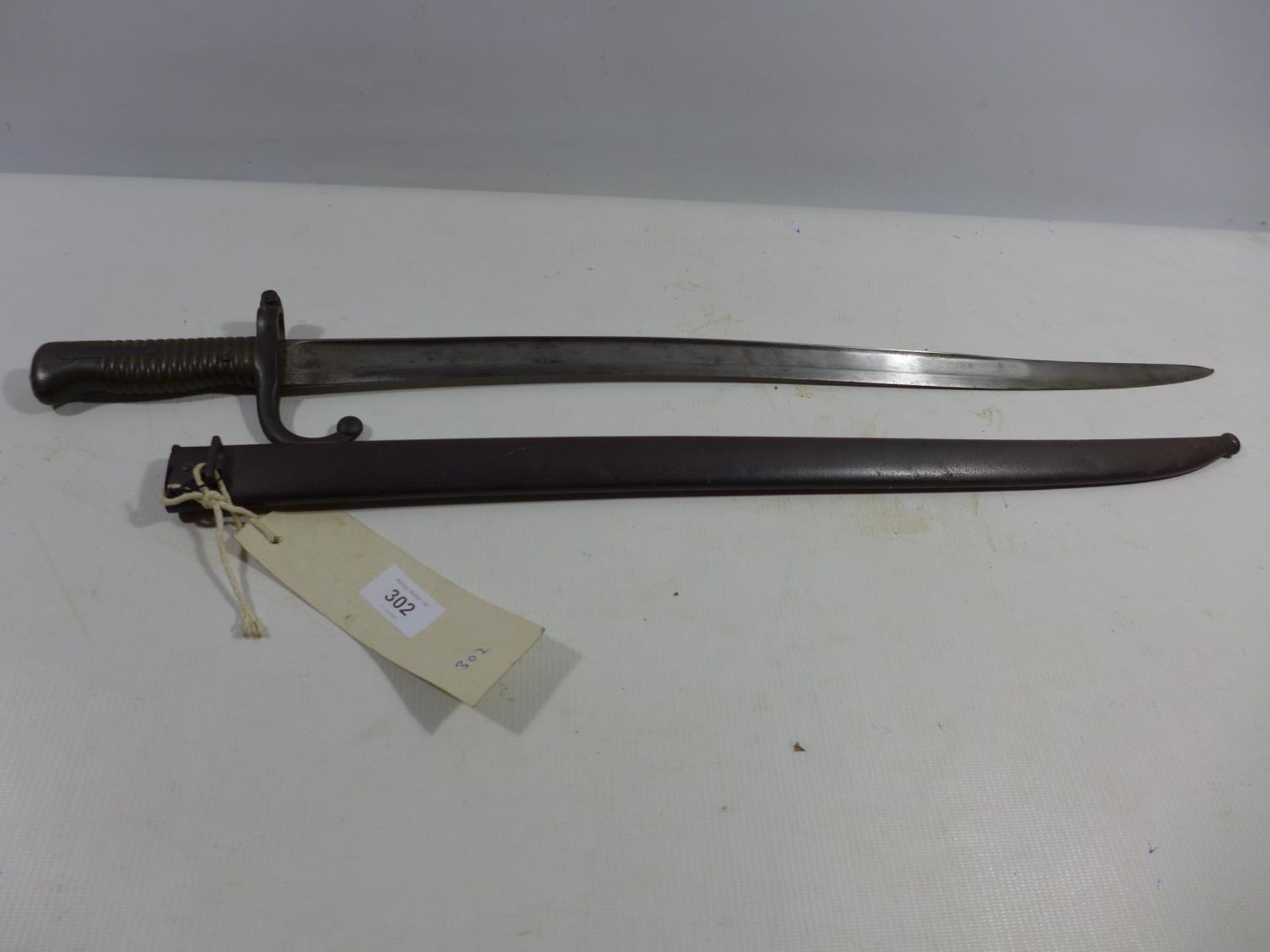 A FRENCH CHASSEPOT BAYONET AND SCABBARD, 57CM BLADE DATED 1870