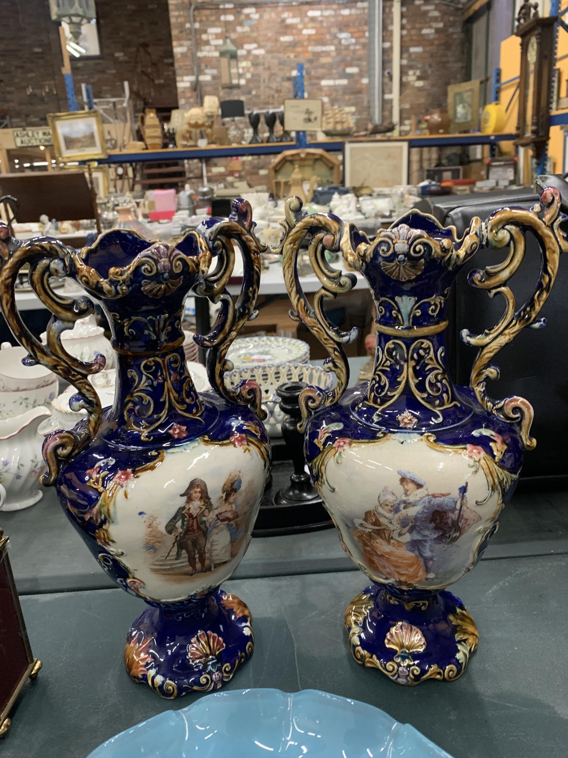 A PAIR OF VICTORIAN VASES IN COBALT BLUE WITH TRANSFER PRINT PATTERN PLUS A PALE BLUE GLASS FOOTED - Image 2 of 2