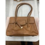 A VINTAGE TAN COLOURED RADLEY BAG WITH COVER