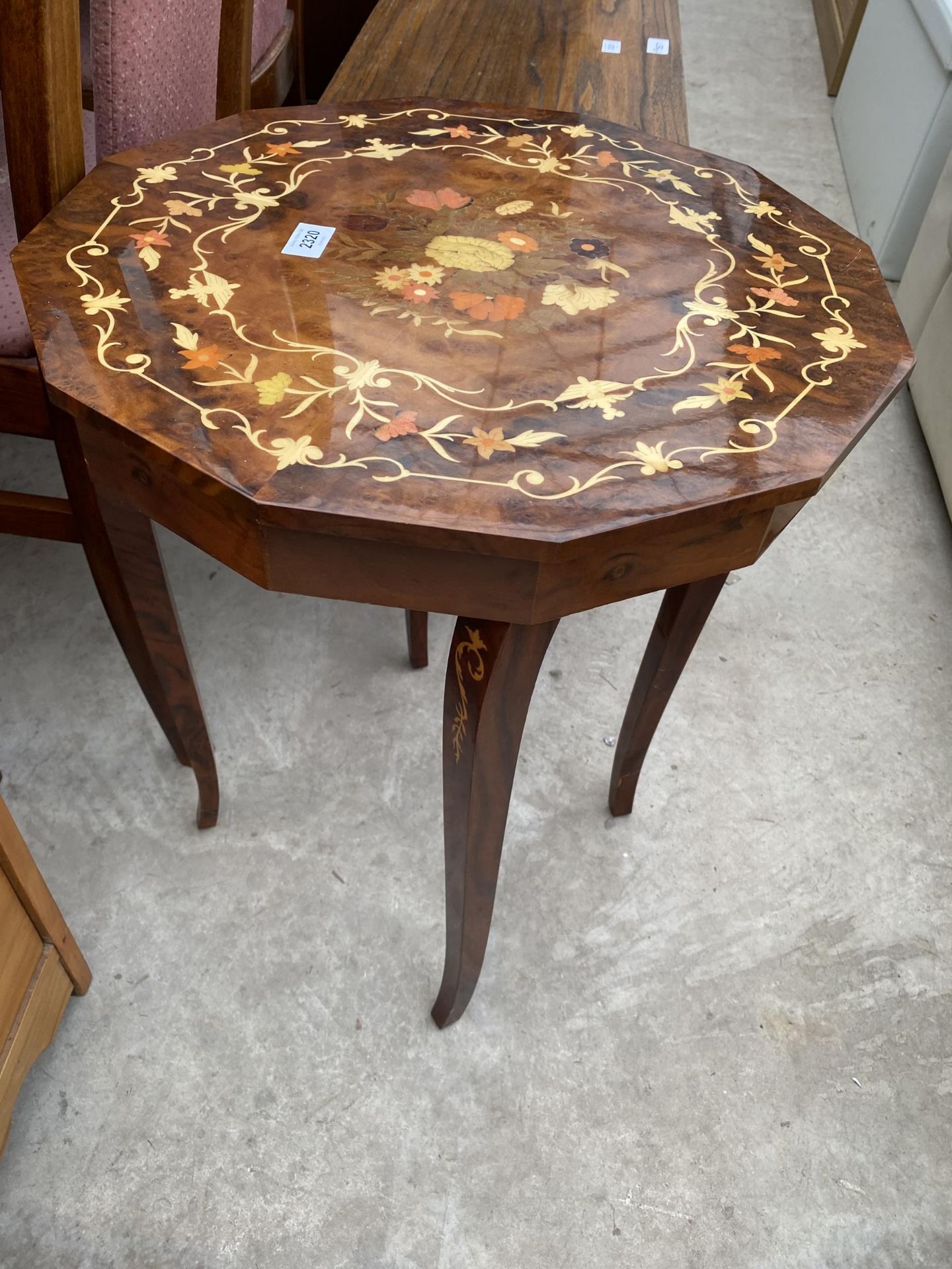 AN ITALIAN PROFUSELY INLAID MUSICAL TABLE, 19" DIAMETER