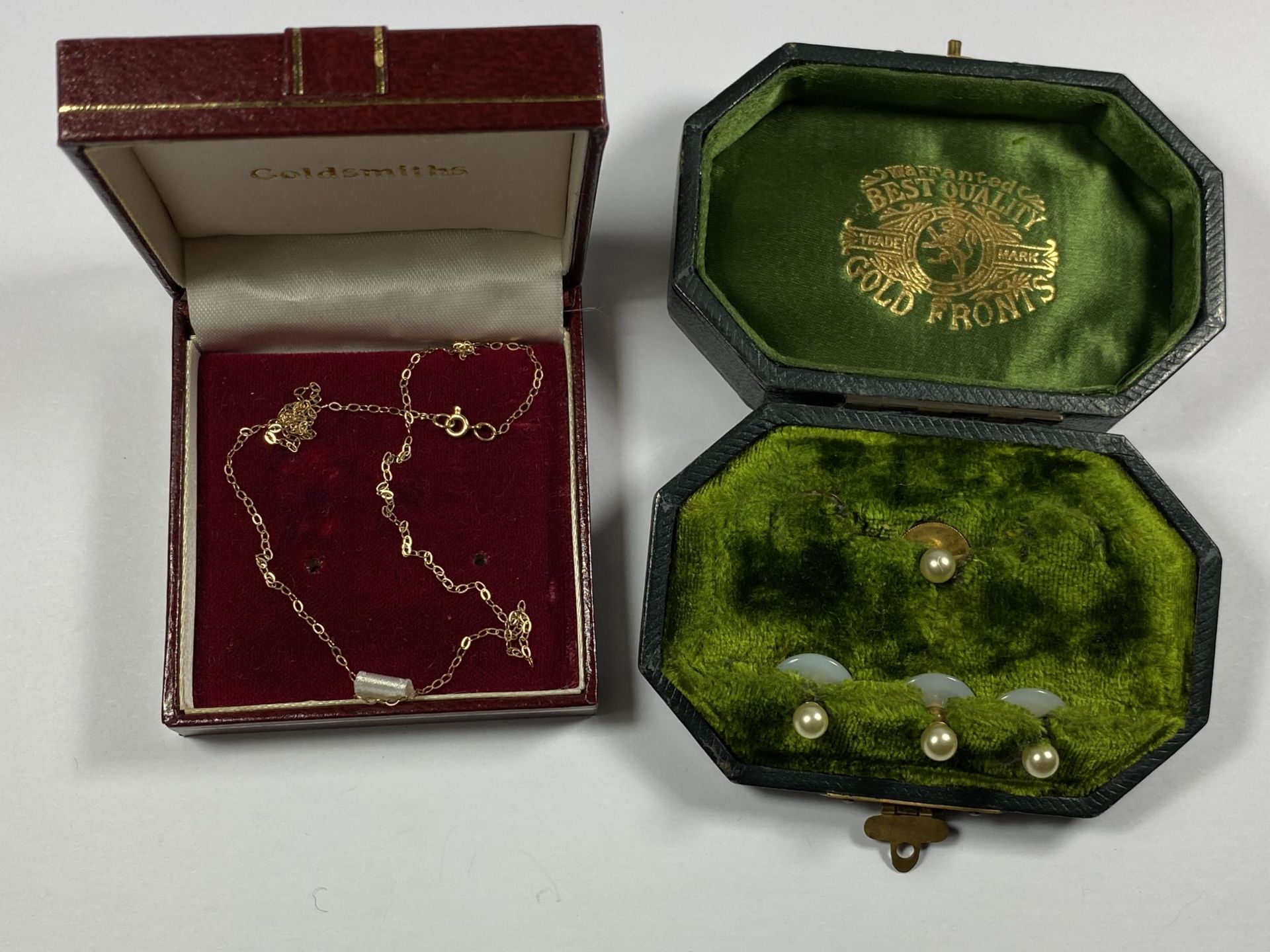 TWO ITEMS - BOXED YELLOW METAL NECKLACE AND PEARL AND GOLD FRONTED STUDS