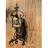 A VINTAGE WROUGHT IRON WALL HANGING BELL WITH MALE FIGURE