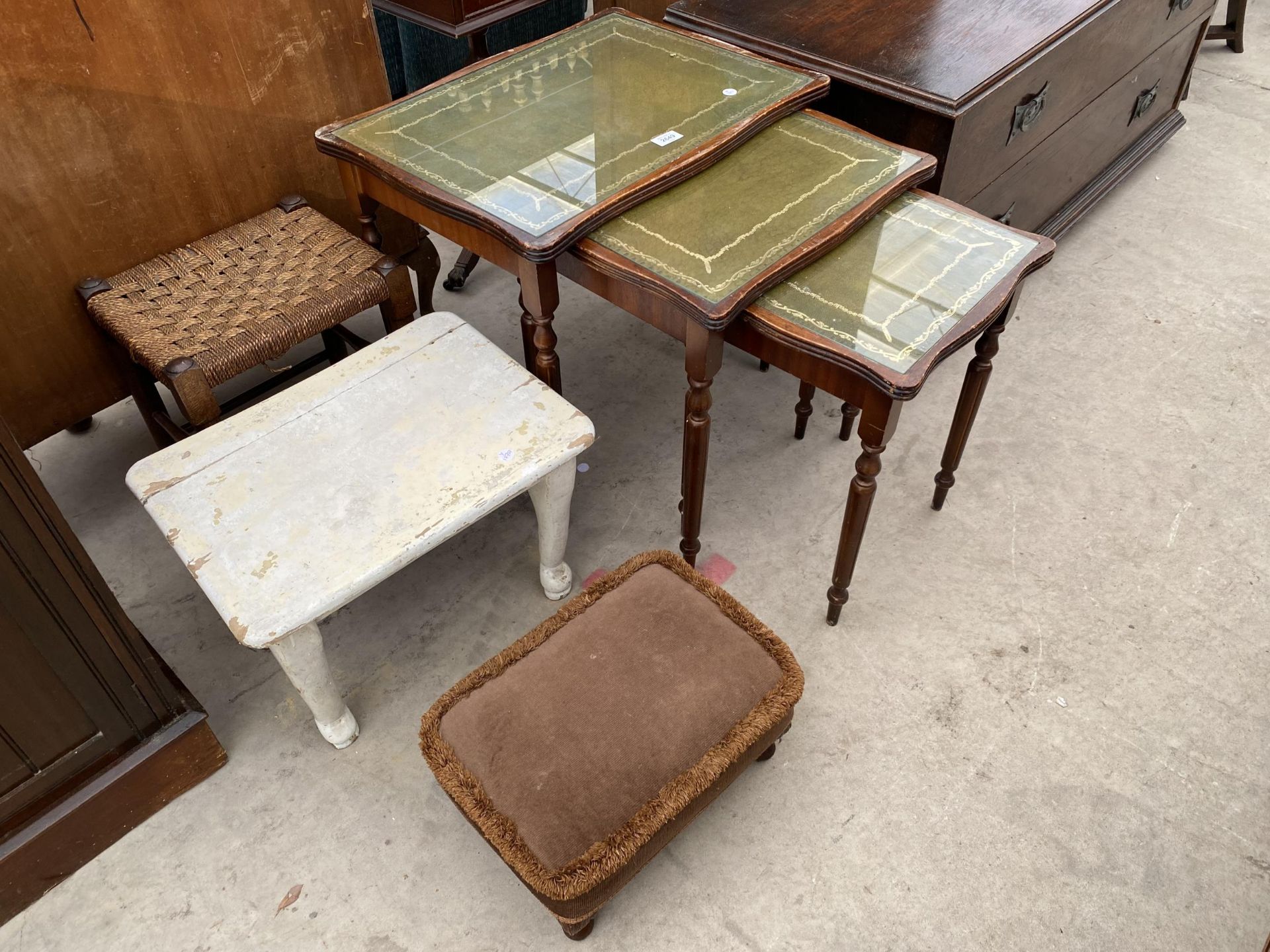 A NEST OF THREE TABLES AND THREE VARIOUS STOOLS