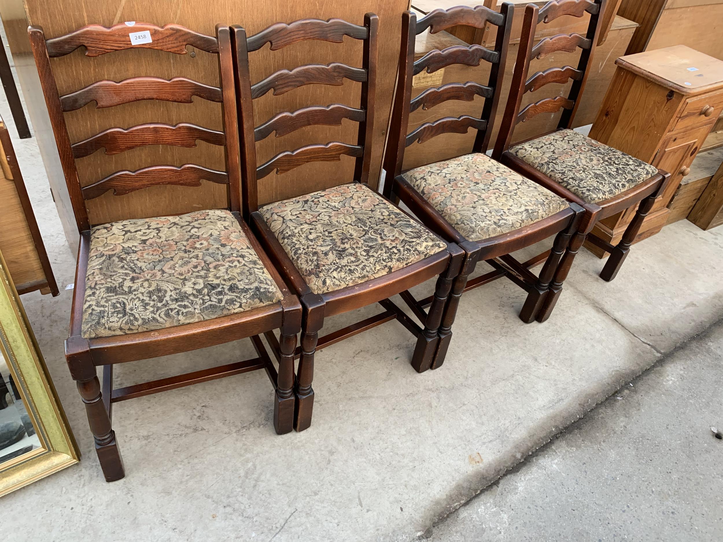 A SET OF FOUR MODERN ELM AND BEECH LADDERBACK DINING CHAIRS