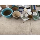 A LARGE ASSORTMENT OF GLAZED AND CERAMIC PLANTERS AND POTS