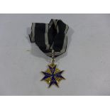 A GILT METAL POUR LE MERITE MEDAL AND RIBBON OF UNKNOWN AGE