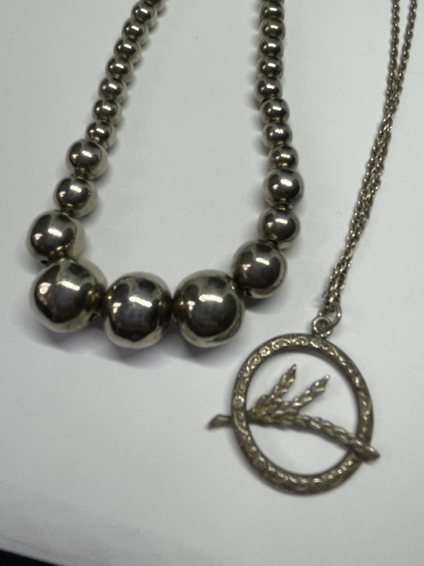 FOUR SILVER NECKLACES ONE BALL DESIGN AND THREE WITH PENDANTS - Image 2 of 3