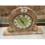 AN ART DECO PINK MARBLE GERMAN MANTLE CLOCK