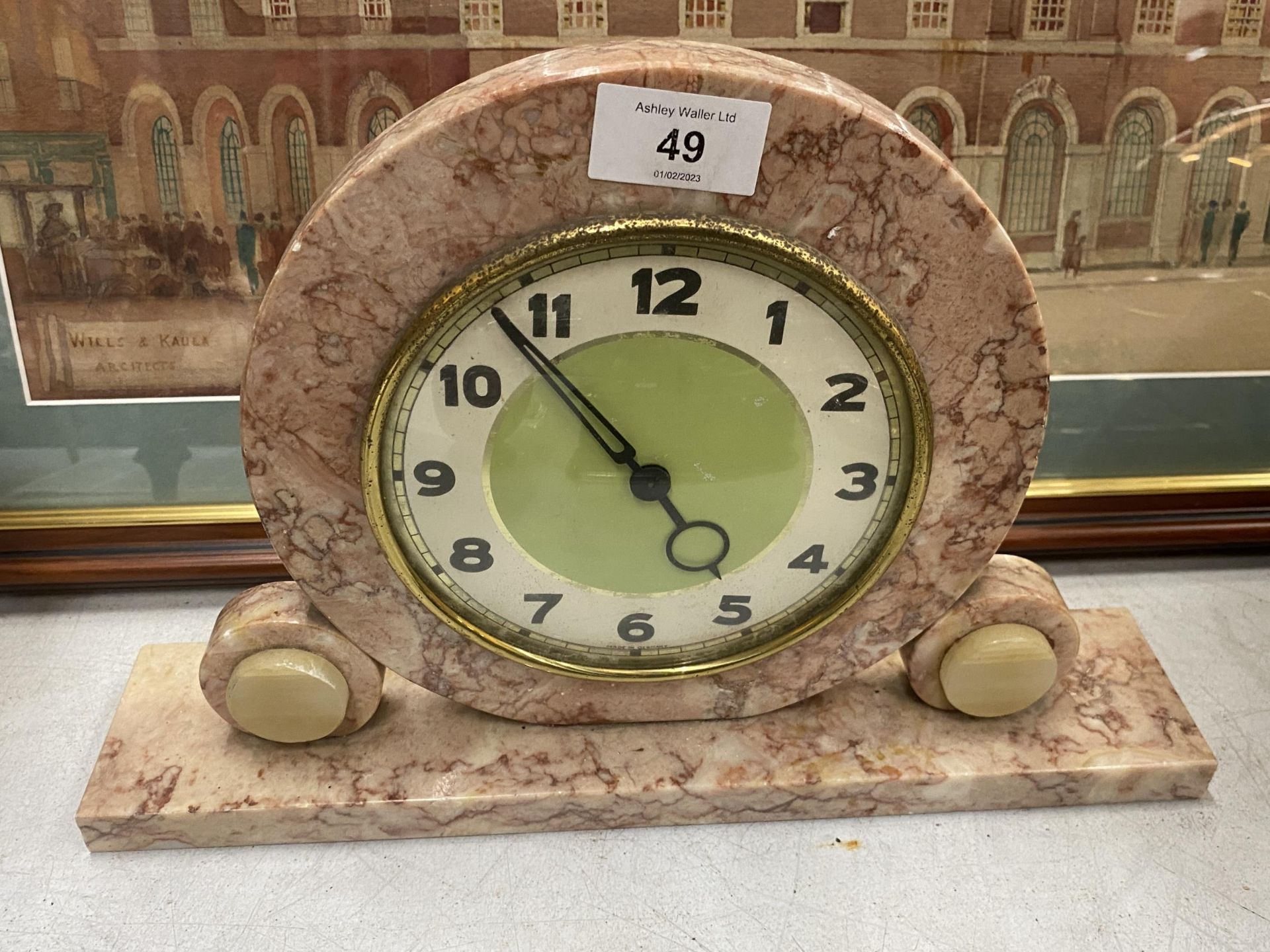 AN ART DECO PINK MARBLE GERMAN MANTLE CLOCK