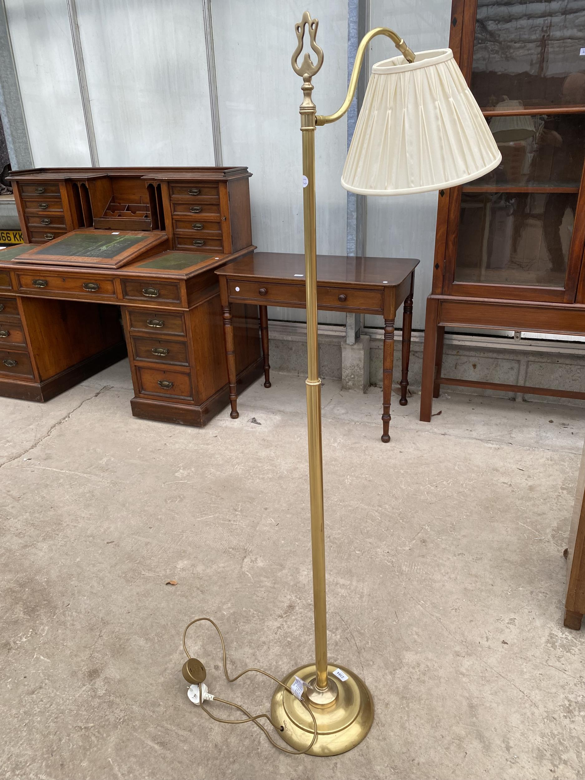 A BRASS READING STANDARD LAMP