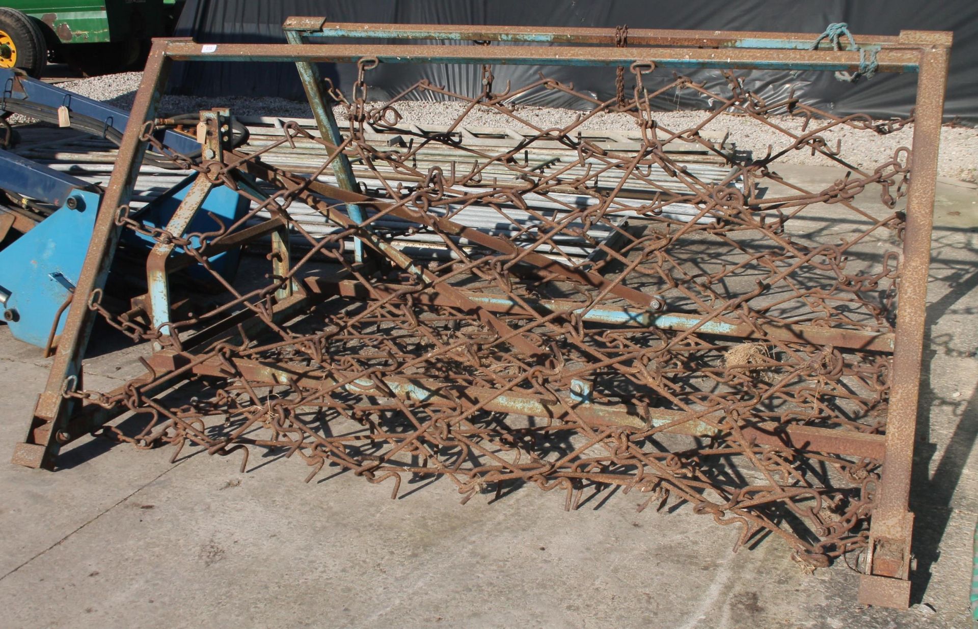 A SET OF CHAIN HARROWS ON A FOLDING FRAME WITH THREE POINT LINKAGE ATTATCHMENTS PLUS VAT