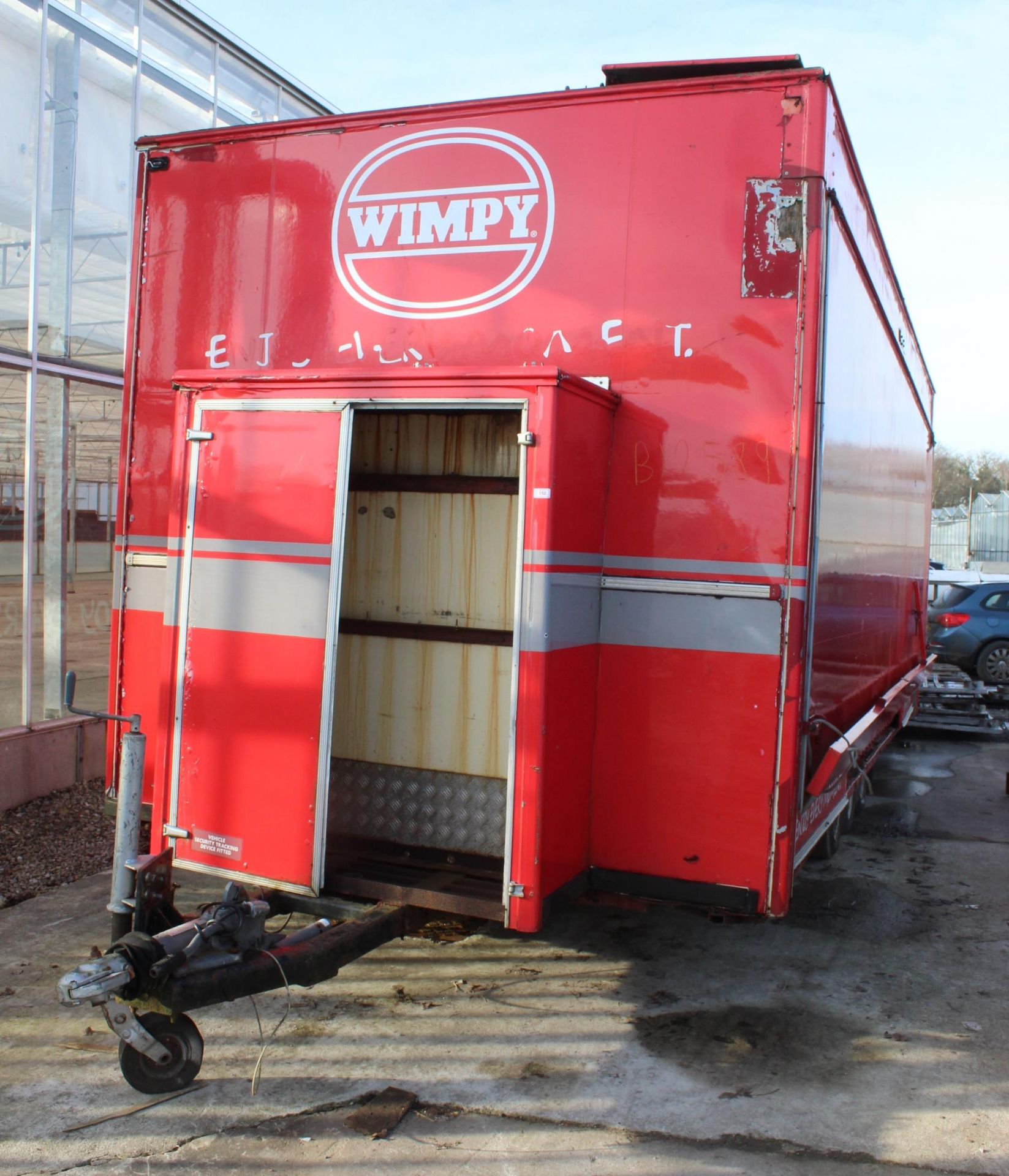 A WIMPEY TRIPLE AXLE CATERING TRAILER WITH SOME FIRE DAMAGE NO VAT