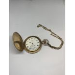 A WALTHAM GOLD PLATED FULL HUNTER POCKET WATCH WITH YELLOW METAL CHAIN