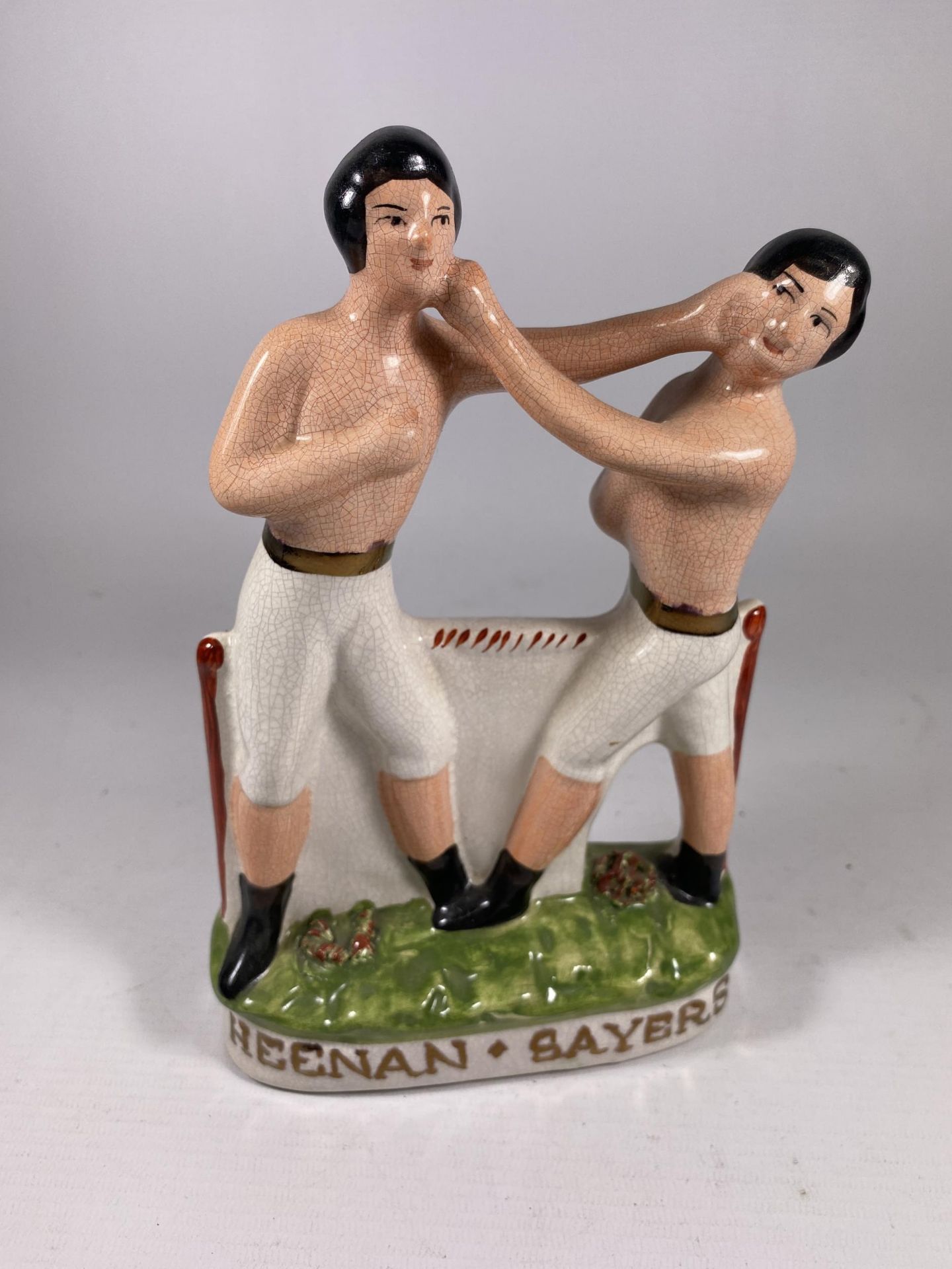 A STAFFORDSHIRE HEENAN & SAYERS POTTERY MODEL OF TWO FIGHTERS