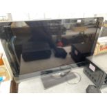 A SHARP 40"TELEVISION WITH REMOTE CONTROL