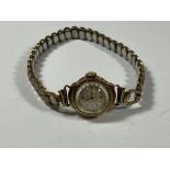 A VINTAGE 9CT YELLOW GOLD CASED 'REGENCY' 17 JEWELS LADIES WATCH