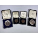 A GROUP OF FOUR VINTAGE CASED BRONZE MEDALS