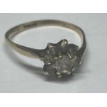 A 9 CARAT GOLD RING WITH CLEAR STONES IN A FLOWER DESIGN SIZE M/N GROSS WEIGHT 1.24 GRAMS