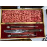 A VINTAGE CASED CARVING SET WITH HALLMARKED SILVER FERRULES