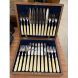 AN OAK CASED CANTEEN OF FISH CUTLERY