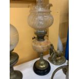A VICTORIAN OIL LAMP WITH A BRASS STEM, MARBLE MIDDLE, FLUTED AND ETCHED SHADE AND CHIMNEY HEIGHT