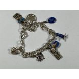 A SILVER CHARM BRACELET AND CHARMS