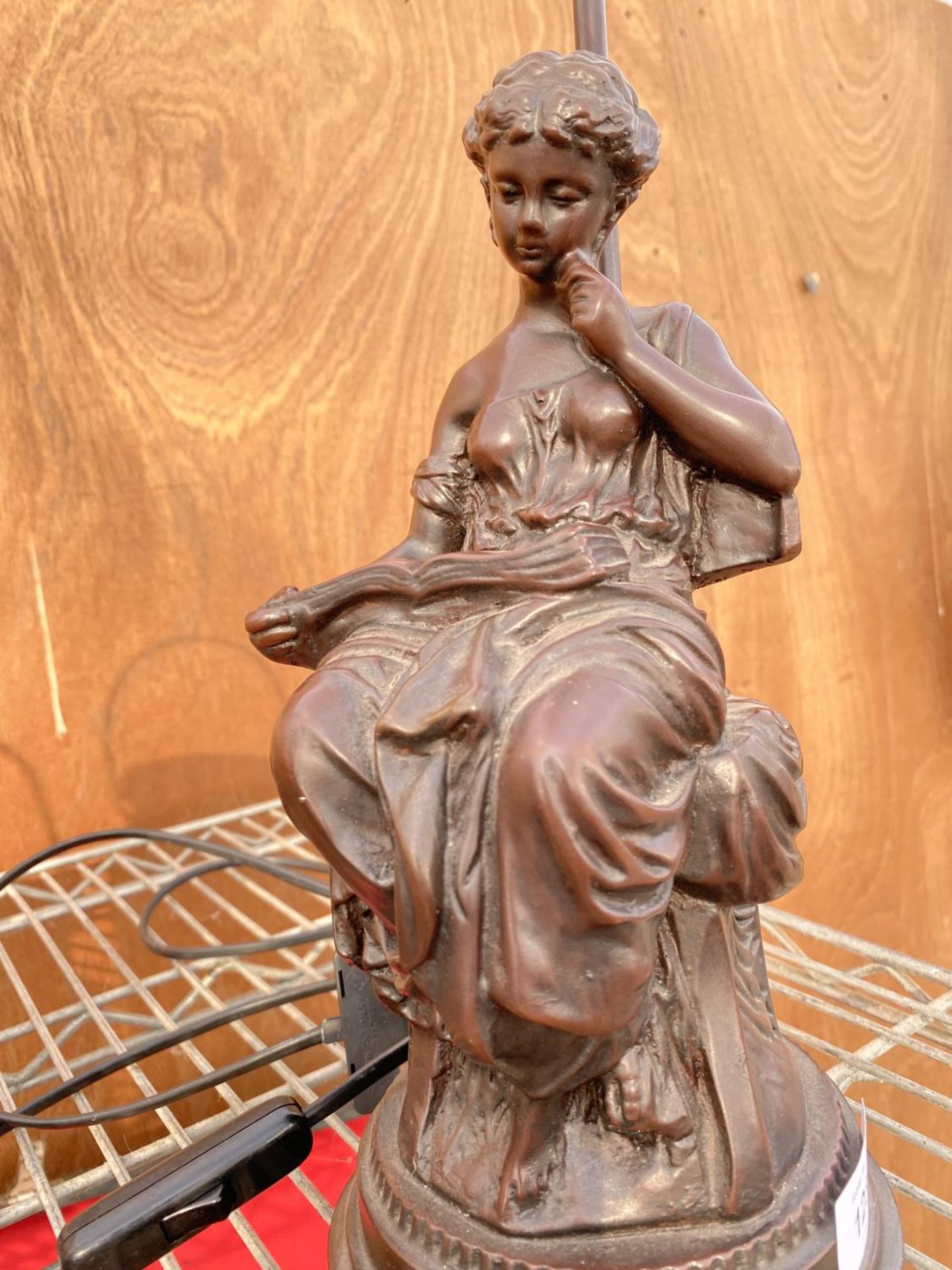 A METAL TABLE LAMP IN THE FORM OF A LADY READING A BOOK WITH A WHITE GLASS SHADE - Image 2 of 3