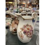 TWO LARGE FLORAL VINTAGE JUGS WITH FLORAL AND FRUIT DECORATION HEIGHT 32CM