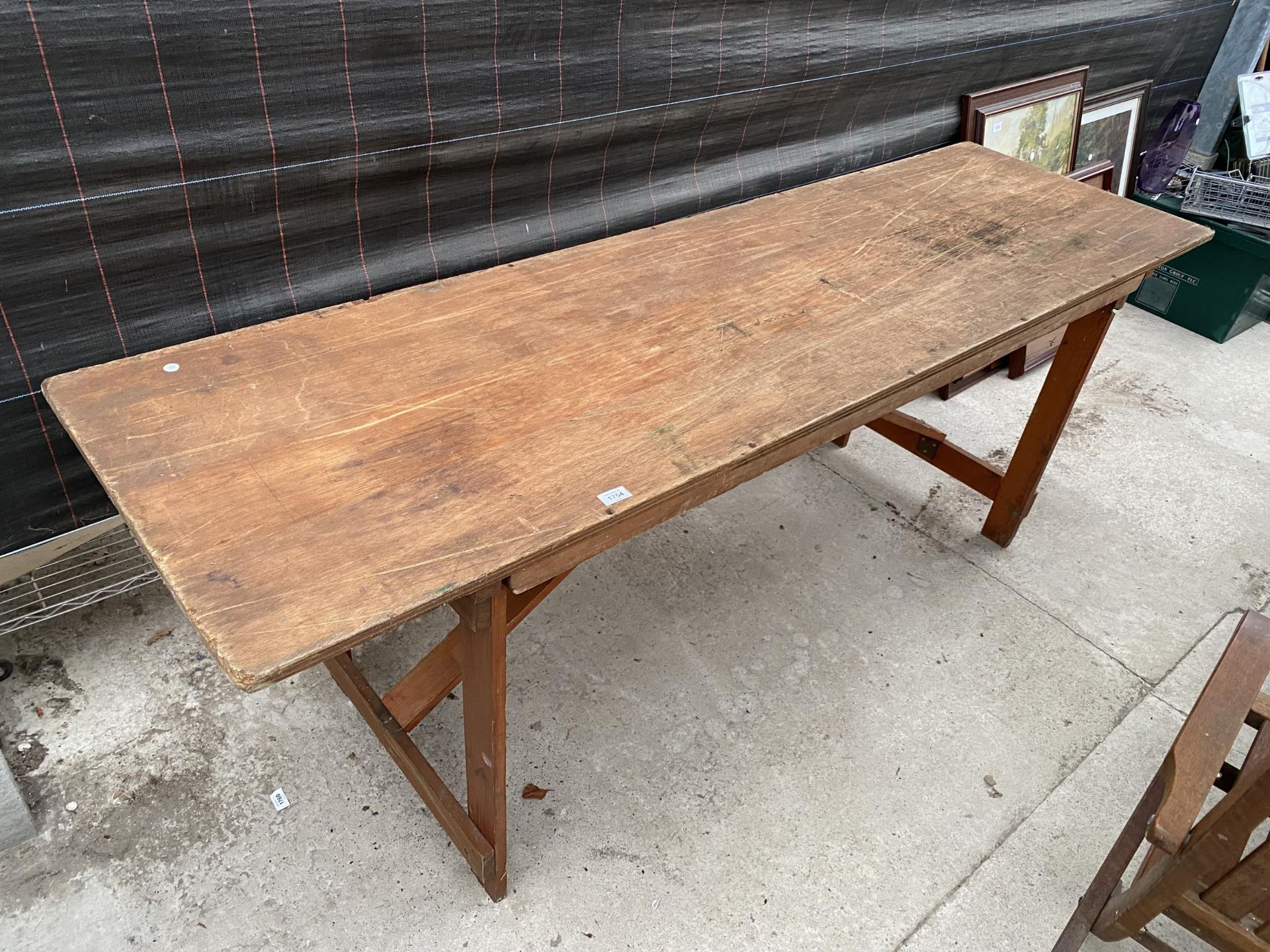 A VINTAGE WOODEN FOLDING TRESTLE TABLE (L:206CM)