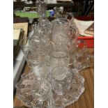 A LARGE QUANTITY OF GLASSWARE TO INCLUDE DECANTERS, JUGS, TUMBLERS, ETC