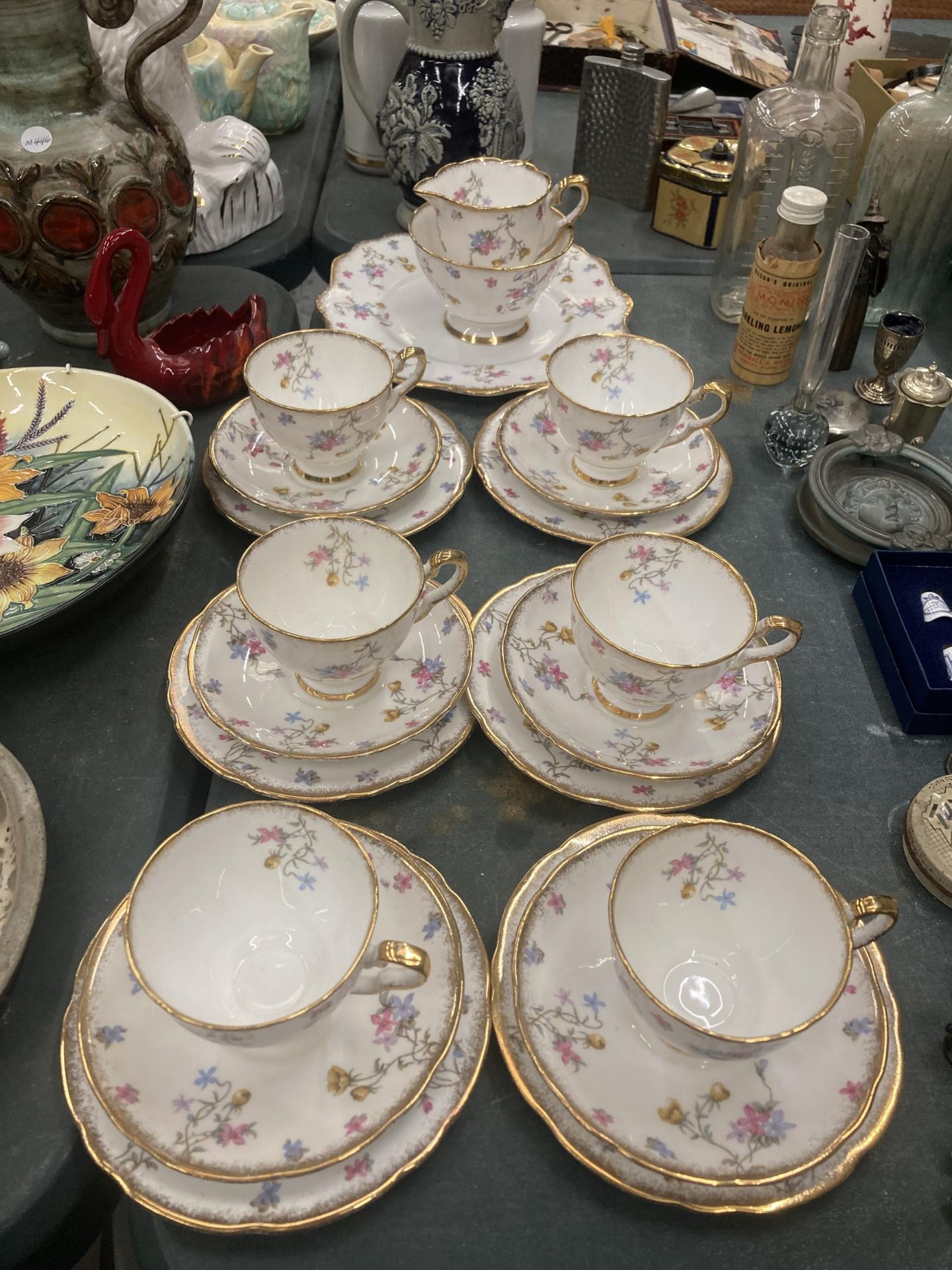 A ROYAL STAFFORD 'VIOLETS POMPADOUR' TEASET TO INCLUDE A CAKE PLATE, CUPS, SAUCERS, SIDE PLATES,
