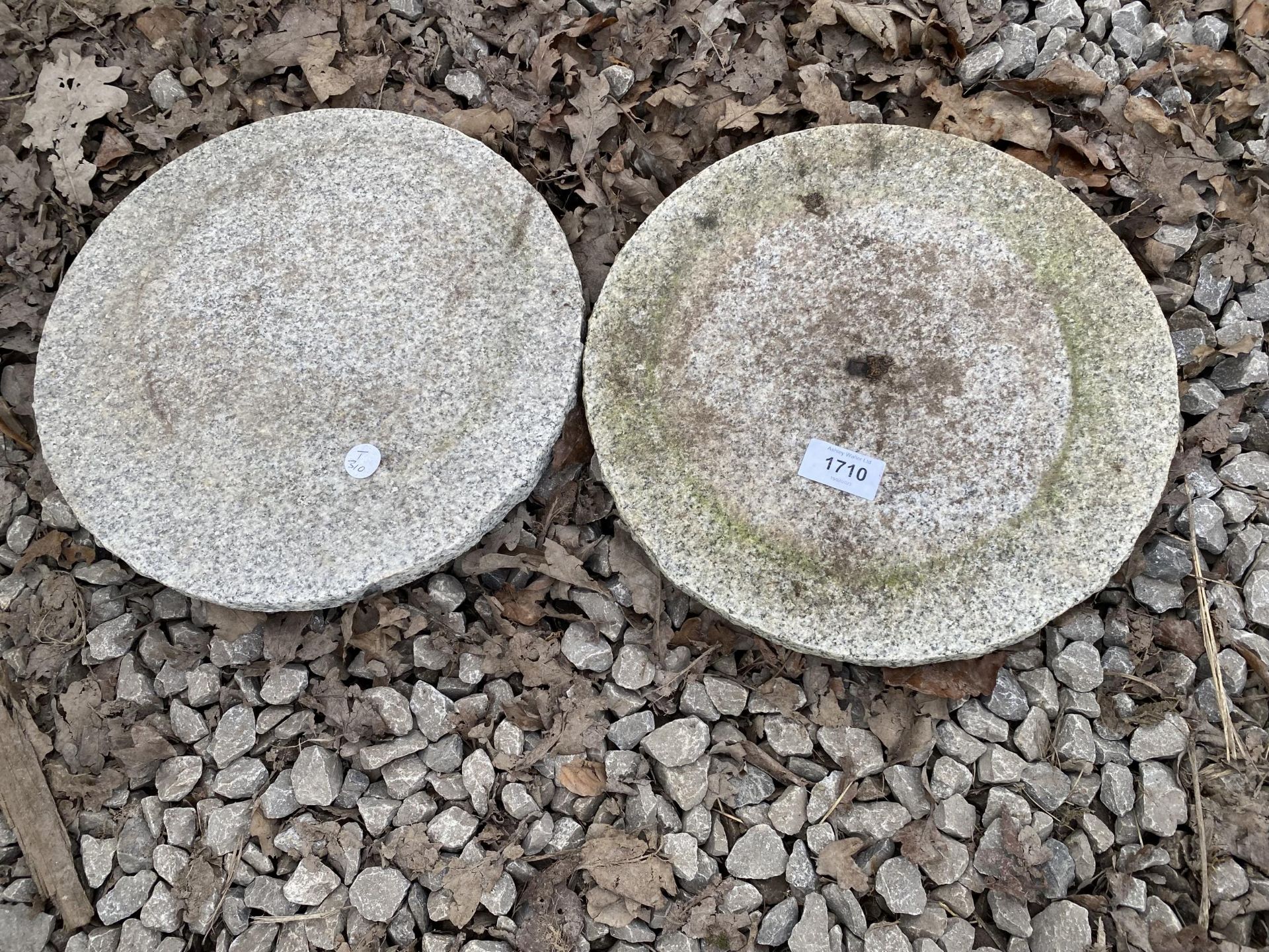 A PAIR OF GRANITE DISCS