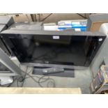 A SONY BRAVIA 26" TELEVISION WITH REMOTE CONTROL