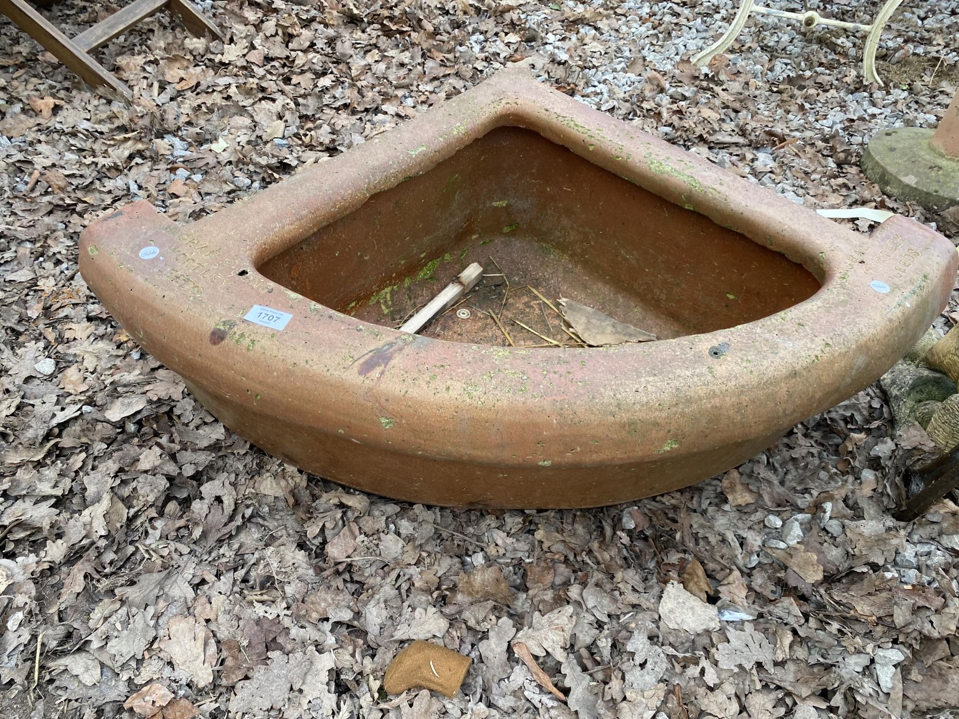 A CURVE FRONTED CORNER SALT GLAZED TROUGH