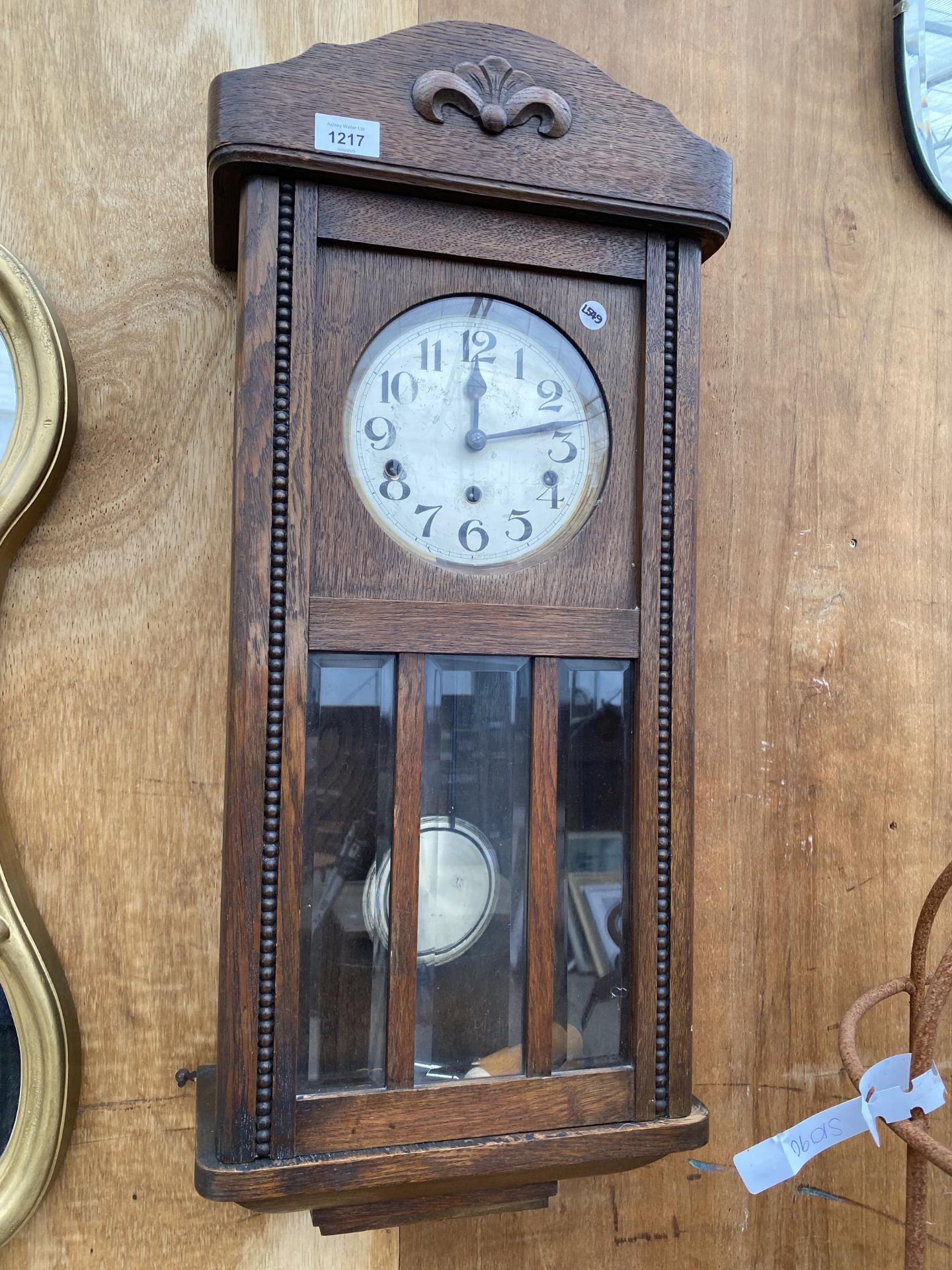 A MID 20TH CENTURY OAK CASED EIGHT DAY WALL CLOCK