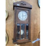 A MID 20TH CENTURY OAK CASED EIGHT DAY WALL CLOCK